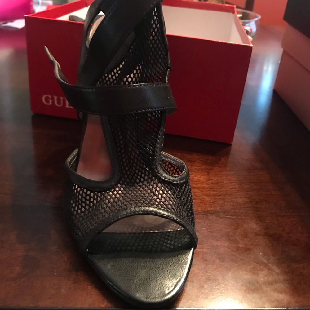 Opened toe, strapped mesh high heel shoe.